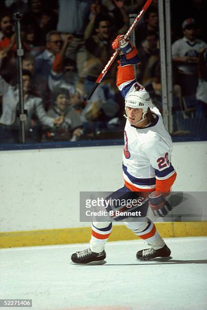 Canadian hockey player Mike Bossy in the uniform of the New York Islanders celebrates a goal during a home game at Nassau Coliseum, Uniondale, New...