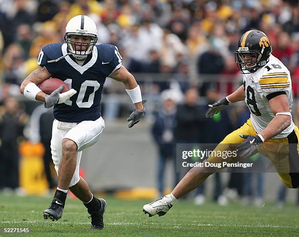 Safety Calvin Lowry of the Penn State Nittany Lions runs upfield from linebacker Chad Greenway of the Iowa Hawkeyes during the game at Beaver Stadium...