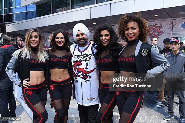 April 16: Toronto Raptors fan poses with the team dancers before the game against the Indiana Pacers in Game One of the Eastern Conference...