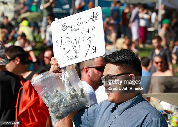 Man sells marijuana as thousands of people gathered at 4/20 celebrations on April 20, 2016 at Sunset Beach in Vancouver, Canada. The Vancouver 4/20...