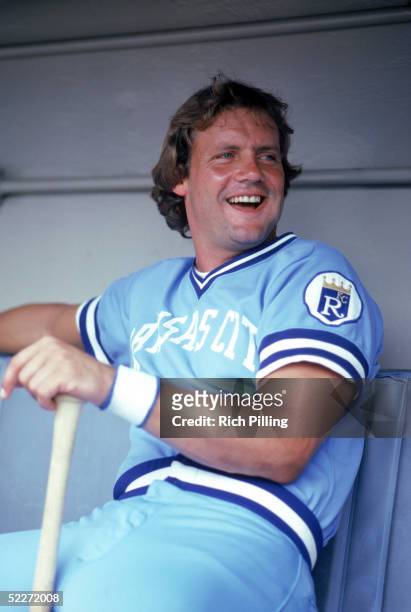 George Brett of the Kansas City Royals smiles as he sits in the dugout during the 1980 MLB season.