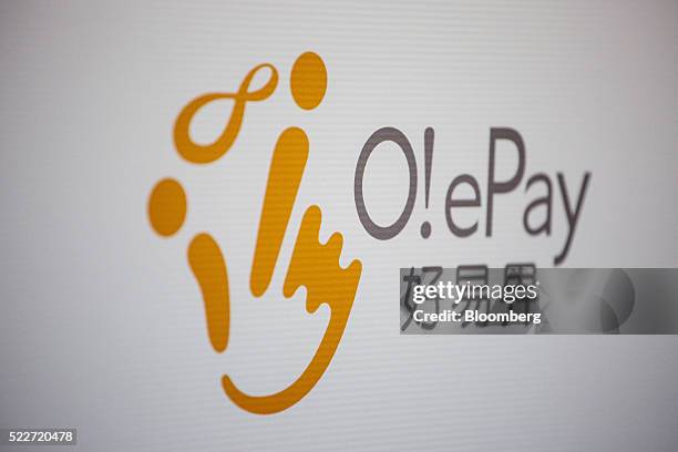 Signage for the O! ePay mobile payment service, operated by Octopus Cards Ltd., a subsidiary of MTR Corp., is displayed at a media event in Hong...