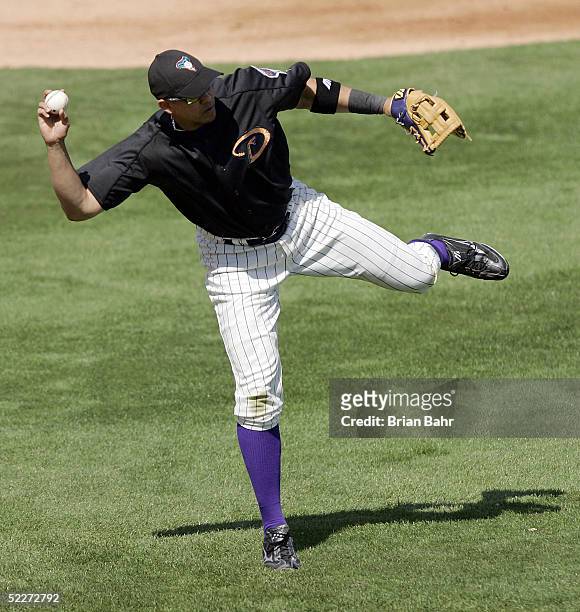 Third baseman Alex Cintron of the Arizona Diamondbacks throws a short hopper to first base against the Chicago White Sox during a spring training...