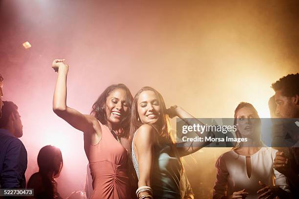 friends dancing at nightclub - dance floor stock pictures, royalty-free photos & images