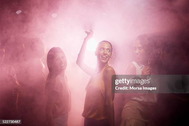 friends enjoying on dance floor - dance floor stock pictures, royalty-free photos & images