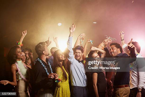 happy friends enjoying at nightclub - people dancing stock pictures, royalty-free photos & images