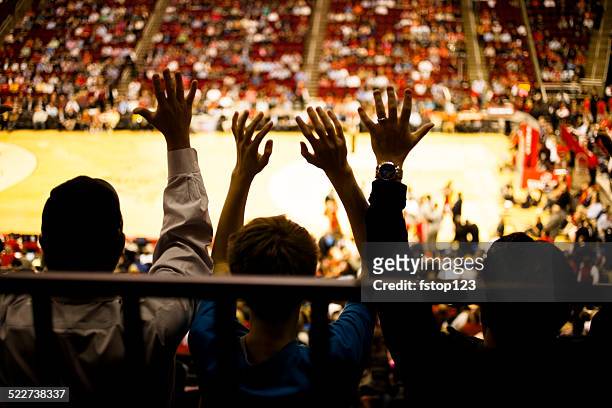large crowd people attend a sports event. stadium. basketball court. - fan enthusiast stock pictures, royalty-free photos & images