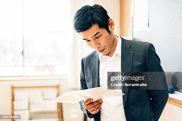 japanese teacher preparing before class - asian teacher stock pictures, royalty-free photos & images