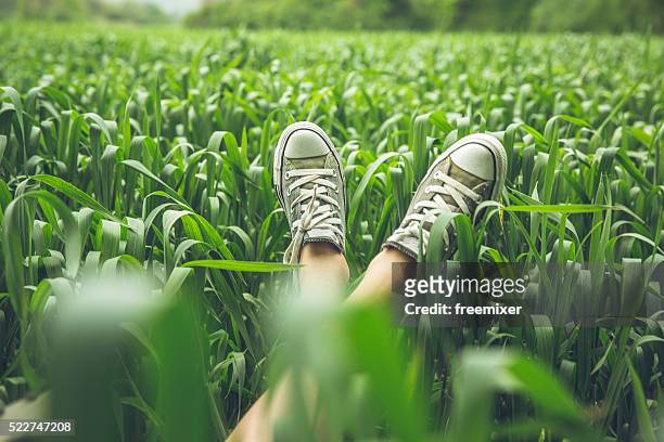 relaxing time - green shoes stockfoto's en -beelden