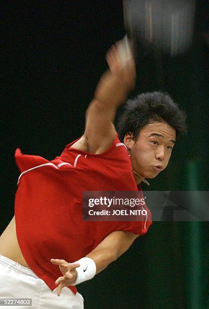 South Korean Woong Sun Jun hits a return against Johnny Arcilla of the Philippines during the singles match at the Davis Cup Asia-Oceania Zone Group...