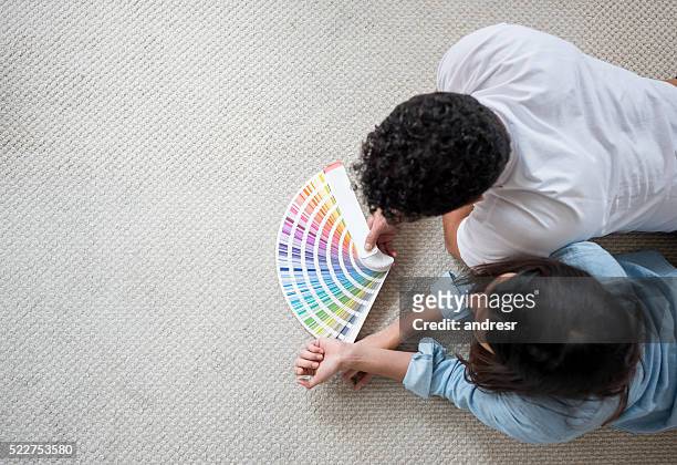 couple painting their house - redesign stock pictures, royalty-free photos & images