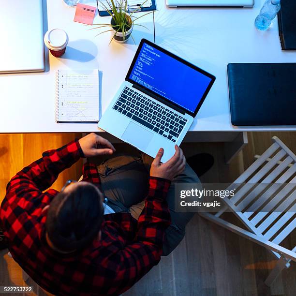developer working in his office. - sticky-notes-covering-computer-monitor stock pictures, royalty-free photos & images