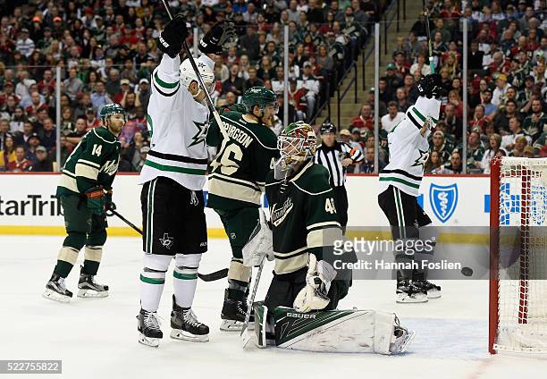 Colton Sceviour and Kris Russell of the Dallas Stars celebrate a goal against Devan Dubnyk of the Minnesota Wild by teammate Ales Hemsky on the power...