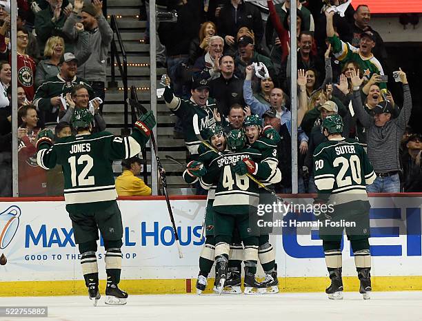 David Jones, Jason Zucker, Jared Spurgeon, Charlie Coyle and Ryan Suter of the Minnesota Wild celebrate a goal against the Dallas Stars by Coyle...