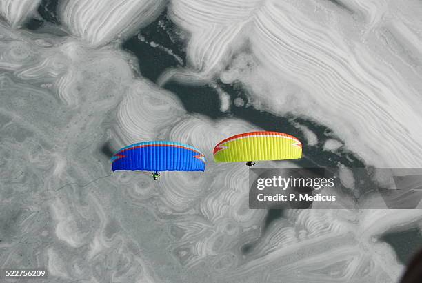 paragliding above frozen lake achensee - antenna aerial stock pictures, royalty-free photos & images