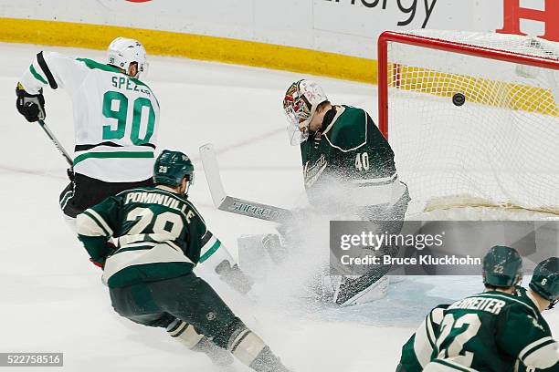 Jason Spezza of the Dallas Stars scores a goal against Jason Pominville and goalie Devan Dubnyk of the Minnesota Wild in Game Four of the Western...