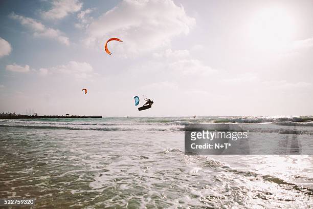 day on the beach - kite surfing stock pictures, royalty-free photos & images