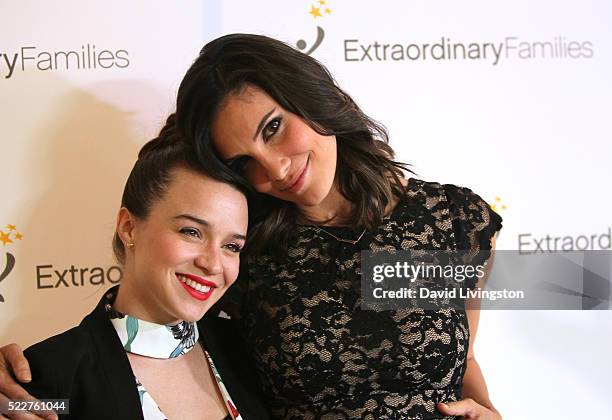 Actresses Renee Felice Smith and Daniela Ruah arrive at the Extraordinary Families Gala at The Beverly Hilton Hotel on April 20, 2016 in Beverly...