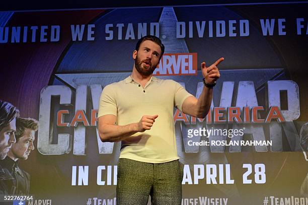 Actor Chris Evans poses for photo call after a press conference at Marina Bay Sands in Singapore on April 21 during a press tour to promote the...