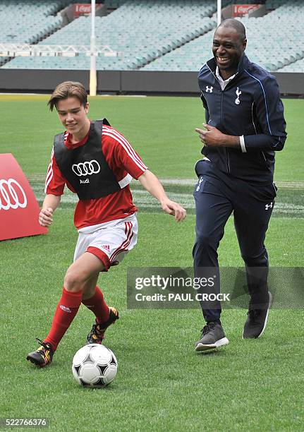 Former Tottenham Hotspur player Ledley King helps in a training clinic with young football players on the MCG during the launch of the 2016...
