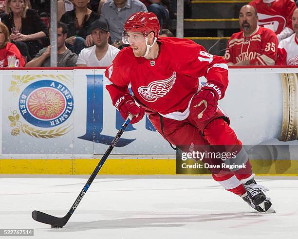 Joakim Andersson of the Detroit Red Wings turns up ice with the puck during Game Three against the Tampa Bay Lightning of the Eastern Conference...