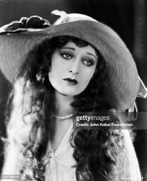 Portrait of actress Dolores Costello Barrymore , wearing a wide brimmed hat, for Warner Brothers Studios, 1924.