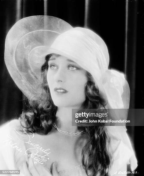 Portrait of actress Dolores Costello Barrymore , wearing a wide brimmed hat, for Warner Brothers Studios, 1924.