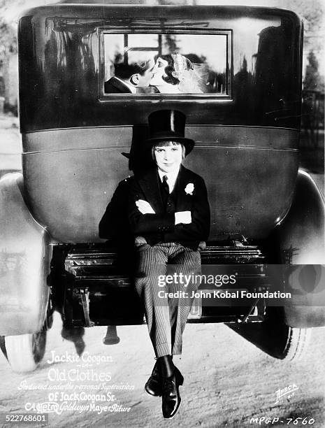 American actor Jackie Coogan in costume wearing a top hat, as he appears in the movie 'Old Clothes', for MGM Studios,1925.