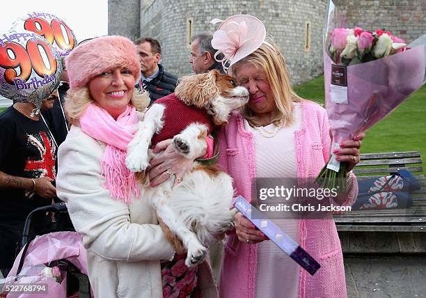 Judy Daley and Anne Daley from Cardiff wait in position for the Queen's 90th Birthday Walkabout on April 21, 2016 in Windsor, England. Today is Queen...