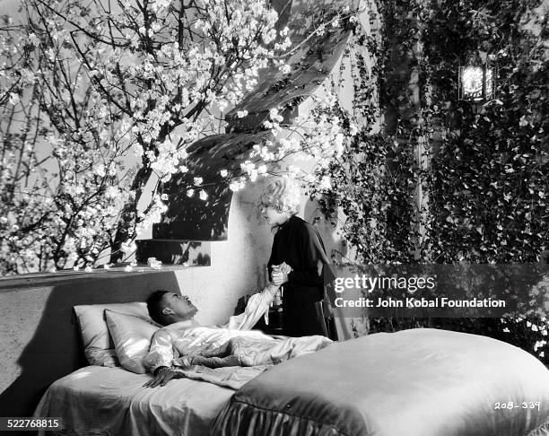 Actors John Gilbert and Mae Murray in a scene from the movie 'The Merry Widow', for MGM Studios, 1925.