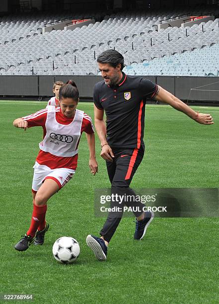 Atletico de Madrid Sporting Director and Club ambassador Jose Luis Perez Caminero helps out during a training clinic with young footballers on the...