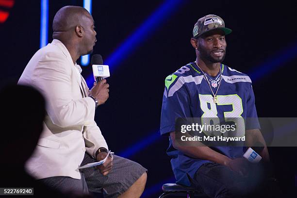 Radio Host Gee Scott and Seattle Seahawks Wide Receiver Ricardo Lockette speak on stage during We Day at KeyArena on April 20, 2016 in Seattle,...