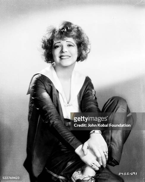 Portrait of actress Clara Bow wearing trouser suit, for Paramount Pictures, 1930.