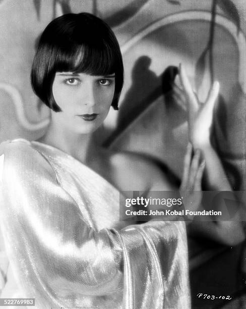 Portrait of actress Louise Brooks wearing a one-shoulder dress, for Paramount Pictures, 1929.