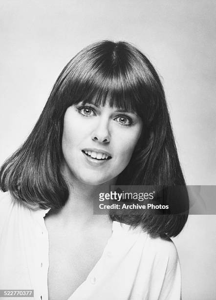 Headshot of actress Pam Dawber, wearing an open necked shirt, circa 1975.