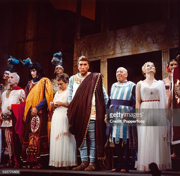 The cast of the West End production of the musical 'A Funny Thing Happened on the Way to the Forum' line up on stage at the Strand Theatre in London...