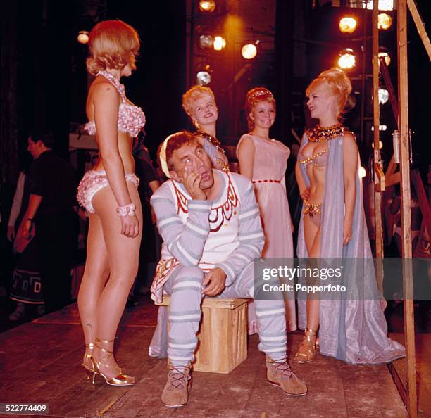 English actor and comedian Frankie Howerd pictured on stage with Isla Blair during rehearsals for the musical 'A Funny Thing Happened on the Way to...