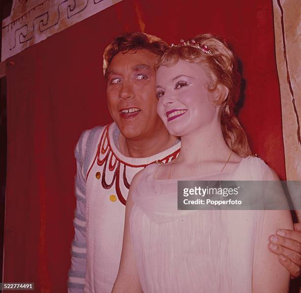 English actor and comedian Frankie Howerd posed backstage with actress Isla Blair during rehearsals for the musical 'A Funny Thing Happened on the...
