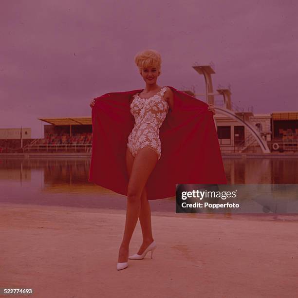 English actress Janette Scott posed wearing a swimsuit and robe on the set of the film 'Contest Girl' in 1964.