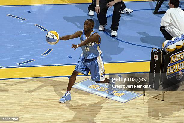 Earl Boykins of the Denver Nuggets passes in the PlayStation Skills Challenge during 2005 NBA All-Star Weekend at Pepsi Center on February 19, 2005...