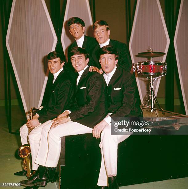 English pop group The Dave Clark Five posed together in London in 1964. Clockwise from bottom left: Denis Payton, Rick Huxley, Lenny Davidson, Mike...