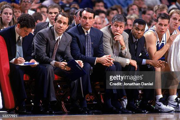 Head coach Mike Krzyzewski, center, of the Duke University Blue Devils sits with his assistants during a NCAA game against the University of Illinois...