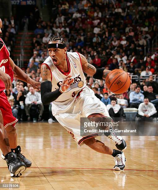 Allen Iverson of the Philadelphia 76ers drives to the net against Eric Snow of the Cleveland Cavaliers on March 4, 2005 at the Wachovia Center in...