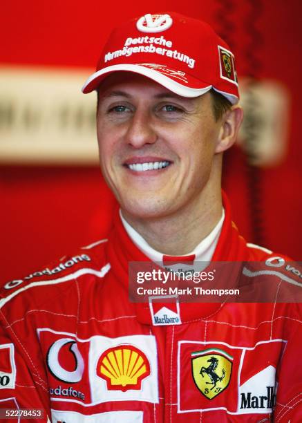 Michael Schumacher of Germany and the Ferrari Team looks on from his pit during qualifying for the Australian Formula One Grand Prix at Albert Park...