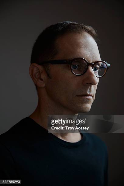 man with stylish glasses looking off camera - tempe arizona stock pictures, royalty-free photos & images
