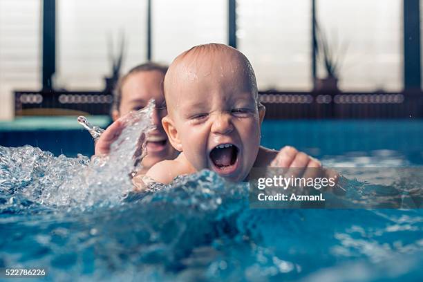 wonderful water world - mother and baby taking a bath stock pictures, royalty-free photos & images