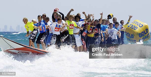 Up to 44 of the world's top surfers ride the world's largest surfboard at Snapper Rocks on March 5, 2005 at Coolangatta, Queensland, Australia....