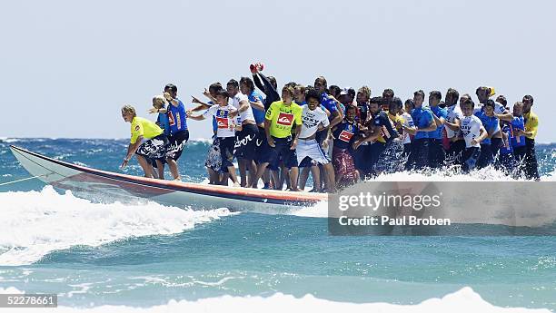Up to 44 of the world's top surfers ride the world's largest surfboard at Snapper Rocks on March 5, 2005 at Coolangatta, Queensland, Australia....