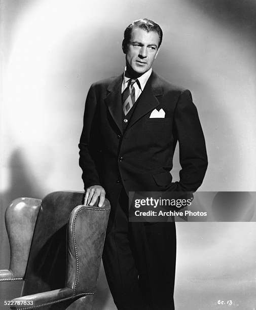 Portrait of actor Gary Cooper, wearing a suit, tie and pocket square, 1942.