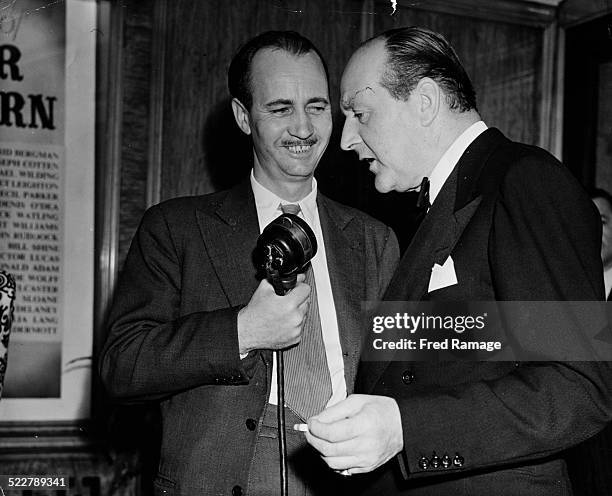 Actor Cecil Parker being interviewed by Douglas Willis of the BBC, at the premiere of the film 'Under Capricorn' at Warner's Theatre, London, 1949.